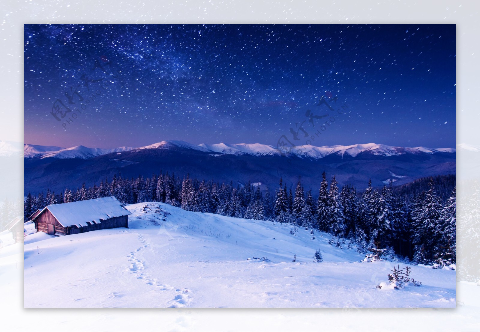 星空下的雪地小屋图片