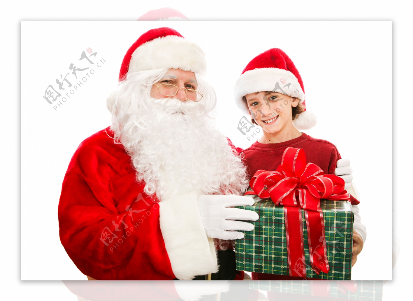 拿着礼物的圣诞老人与小男孩图片