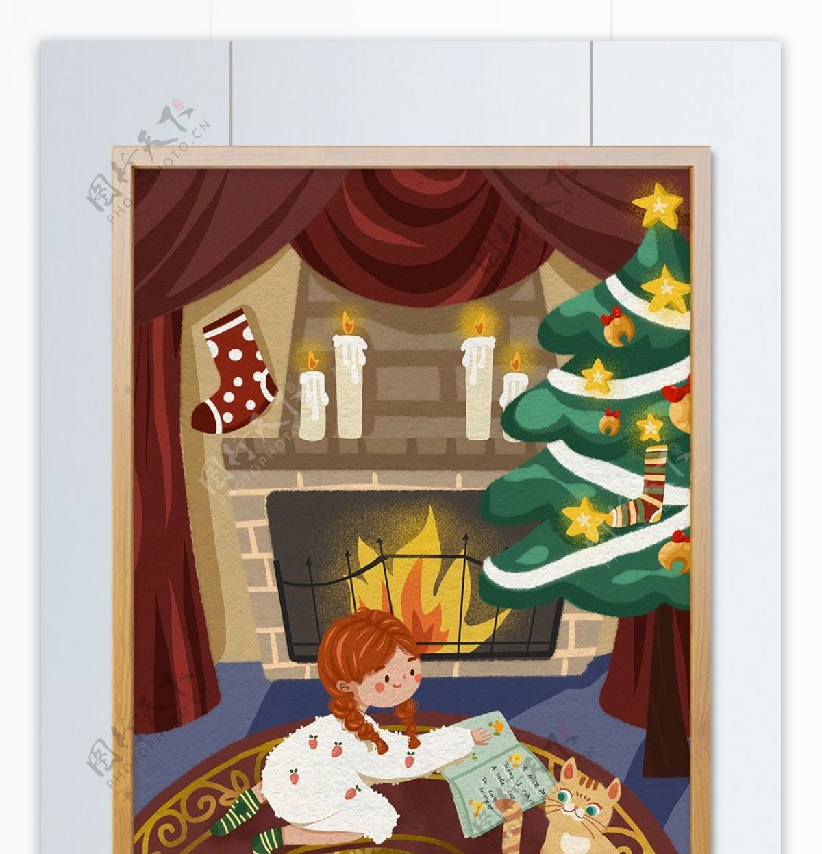 圣诞节小女孩在壁炉前看书和小猫一起玩耍